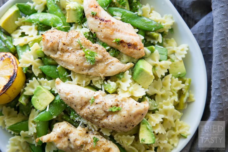 Hot Asparagus, Snap Pea, and Avocado Pasta Salad // This delicious pasta served with grilled chicken and lemon is the perfect dish to serve for any special occasion. Avocado lovers will swoon over the smooth, creamy, and flavorful incorporation into this tasty dinner idea! | Tried and Tasty