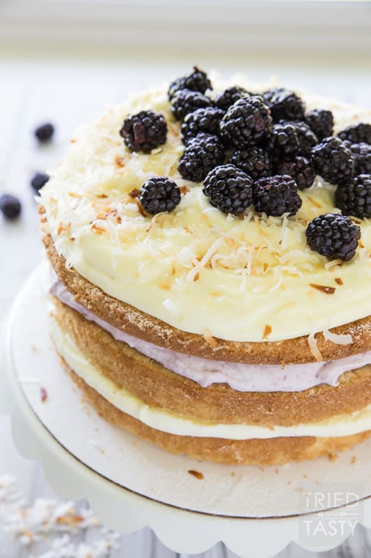 Blackberry Pina Colada Cake // Do you love Pina Coladas? You'll want to get your hands on this fun twist. With the addition of blackberry you've got a next level fruit explosion. The flavors marry together beautifully! | Tried and Tasty