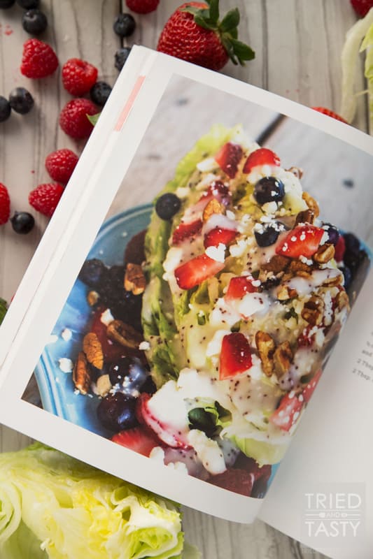 Mixed Berry Wedge Salad // Serve this at your next BBQ! You only need a handful of ingredients including: fresh lettuce, in-season berries, dressing and cheese. The crowd will go nuts with the stunning side dish! | Tried and Tasty