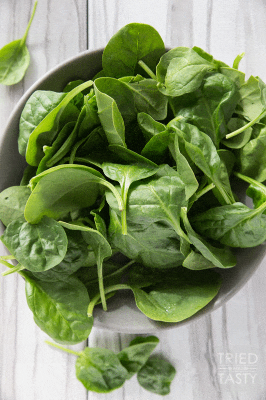 Spinach Salad // You will fall in love at first taste with this salad. A delicious combination of so many wonderful flavors. Great addition to any dinner table spread. Great for BBQ's, picnics, potlucks, or holiday parties. Simple to put together! | Tried and Tasty