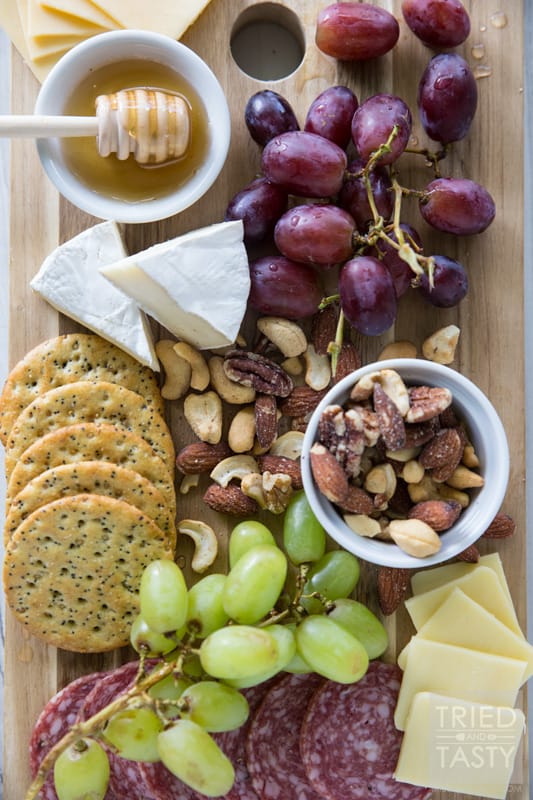 How To Build The Perfect Cheese Board // If you want a show stopper at the beginning of your dinner party, you do not want to miss this excellent how-to. What components do you need? Why do you need them? Your guests will love this perfect combo! | Tried and Tasty