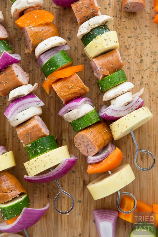 Grilled Sausage & Veggie Kabobs // When temps are rising it's time to take dinner outside. These kabobs are absolutely perfect and completely customizable. Swap in your fav veggies, skewer up your favorite sausage and voila you've got a delicious dinner in only a matter of minutes! | Tried and Tasty