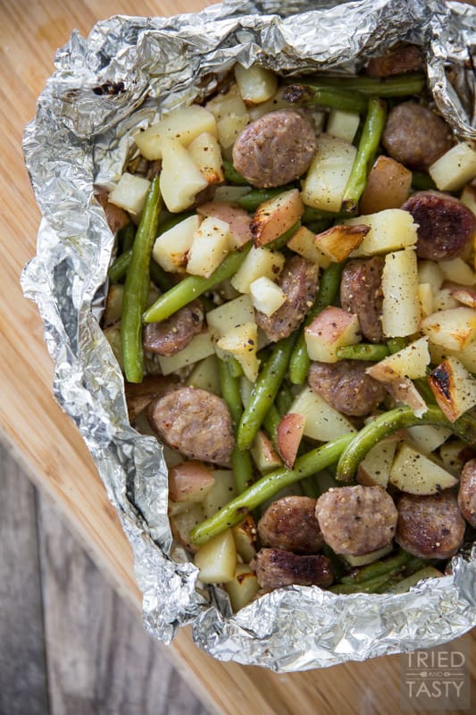 Italian Sausage Tin Foil Dinner // Want a meal that can double as an at-home dinner AND a camping dinner? These tin foil dinners are exactly what you're looking for. Simple to make, flavorful, and ready in 30 minutes. Perfection! | Tried and Tasty