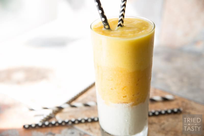 Candy Corn Layered Smoothie // Halloween treats are often associated with lots and lots of sugar BUT they don't have to be! This smoothie is made with real fruit, no added sugar, and the perfect sippable for any spooky night of the week in October! Make this healthy candy corn inspired smoothie for the kids AND adults! | Tried and Tasty