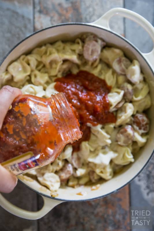 Two-Timin' Tortellini and Sausage // This simple one pot meal is perfect any night of the week. Ready in 30 minutes, tasty enough for the whole family, and with the addition of sausage it's a hearty filling dinner you'll love! | Tried and Tasty
