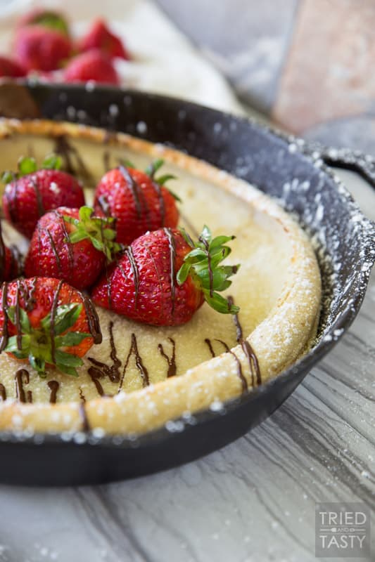 Chocolate Covered Strawberry Dutch Baby Pancakes // You've had a german pancake (or Dutch Baby as they are also called) but have you had this delightful chocolate covered strawberry version? Probably not... but I'm here to change that. This would be the most excellent breakfast to wake up to! | Tried and Tasty