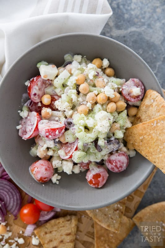 Mediterranean Chickpea Salad // This salad SCREAMS garden goodness! If you're growing tomatoes, cucumber, and dill... I recommend you grab everything else you need to put this together. It's absolutely delightful and perfect paired with homemade baked pita chips! | Tried and Tasty