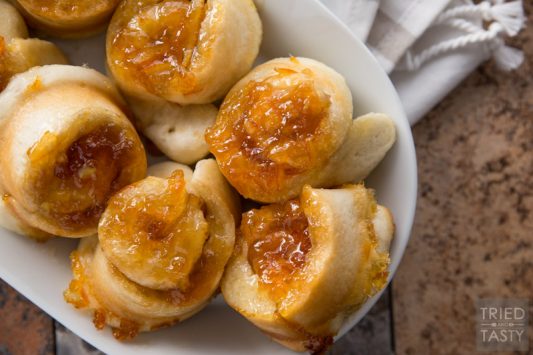 Orange Marmalade Rolls // Orange rolls have never been easier. Starting with frozen dough, these require less than five ingredients. All of which you probably already have on hand. Great for breakfast any morning, brunch any weekend, or any special holiday in between! | Tried and Tasty