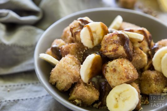 Pumpkin Spice Bananas Foster French Toast Bites // French toast is taken next level with these adorably delicious bites of heaven. You won't believe how wonderfully the flavors come together in this amazing fall inspired breakfast (that can be enjoyed all year long). The best bananas foster breakfast dessert around! | Tried and Tasty