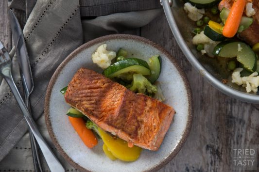 Pan Seared Coconut Oil Salmon and Veggies // This healthy dinner idea is packed with protein and flavor. An excellent meal to add into your rotation. One bite and you'll add it to the rotation week after week! | Tried and Tasty