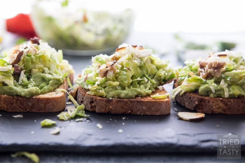 Cheesy Brussels Sprouts and Avocado Toast // Avocado toast is all the rage. However. You haven't had THIS avocado toast before! This will change your life. Even if you don't like avocados you will LOVE this delicious combination. This recipe has everything you want in an avo toast: a little bit of crunch, a little bit of cheese, some veggies and a whole lot of flavor. | Tried and Tasty