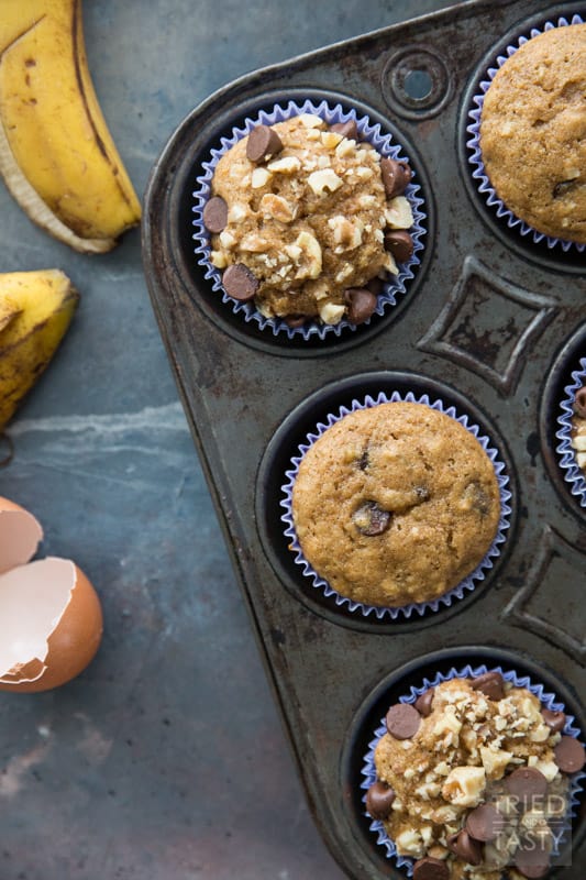 Chocolate Chip Banana Nut Muffins // Words can't describe how delicious these muffins are! You would never guess they were made with whole wheat and without any refined sugar. You'll just have to try them for yourself. Next time you find yourself needing to use up some over-ripe bananas, remember this recipe! | Tried and Tasty