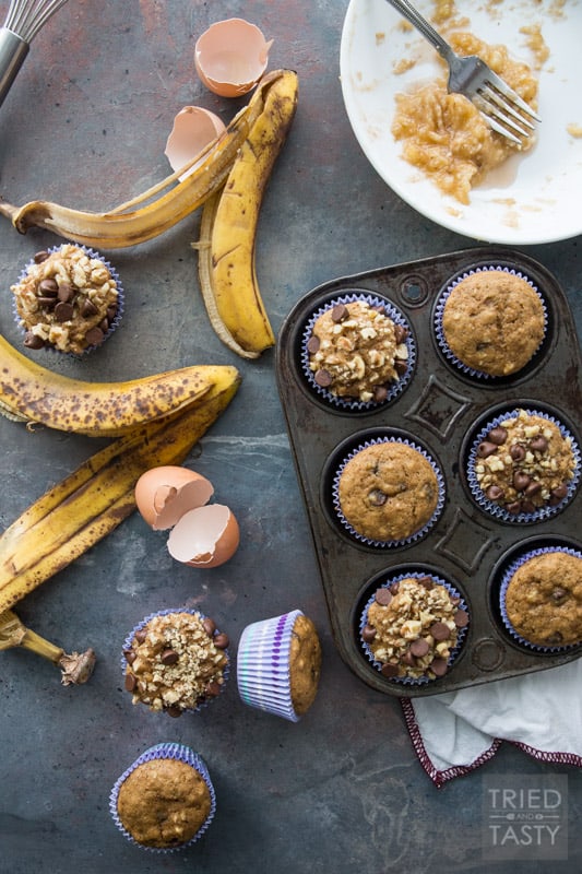 Chocolate Chip Banana Nut Muffins // Words can't describe how delicious these muffins are! You would never guess they were made with whole wheat and without any refined sugar. You'll just have to try them for yourself. Next time you find yourself needing to use up some over-ripe bananas, remember this recipe! | Tried and Tasty