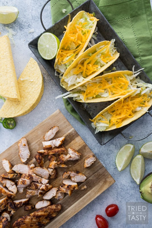 Fire Grilled Chicken Tacos // You haven't had chicken tacos until you've had THESE chicken tacos! This quick and easy weeknight meal will solve your problem to get a meal on the table for those busy nights! You won't believe how tender and flavorful the chicken is! | Tried and Tasty