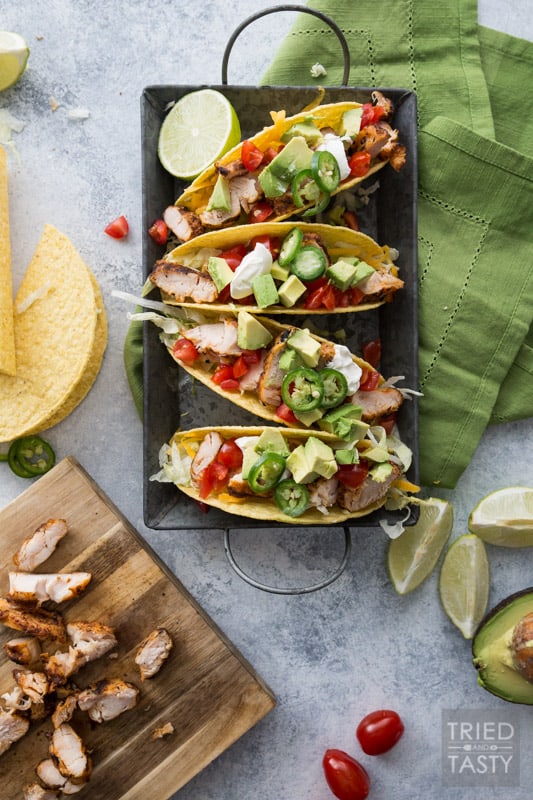 Fire Grilled Chicken Tacos // You haven't had chicken tacos until you've had THESE chicken tacos! This quick and easy weeknight meal will solve your problem to get a meal on the table for those busy nights! You won't believe how tender and flavorful the chicken is! | Tried and Tasty