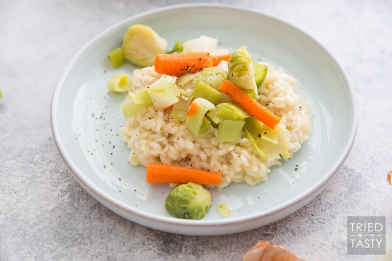 Risotto with Parmigiano Reggiano and Steamed Winter Veggies // This comforting meal is perfect for the cold winter months. Plus made with seasonal veggies that pair perfectly with one another! Warm, cheesy, and filling. All that you could ask for in a delicious dinner! | Tried and Tasty