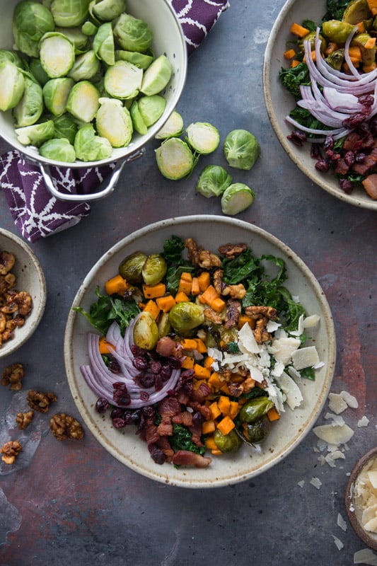 Sweet Potato, Kale and Brussels Sprouts Winter Bowl // This winter bowl is the perfect cure to the seasonal blues. Packed with delicious veggies and ever so slightly sweetened with maple candied walnuts and cranberries! | Tried and Tasty