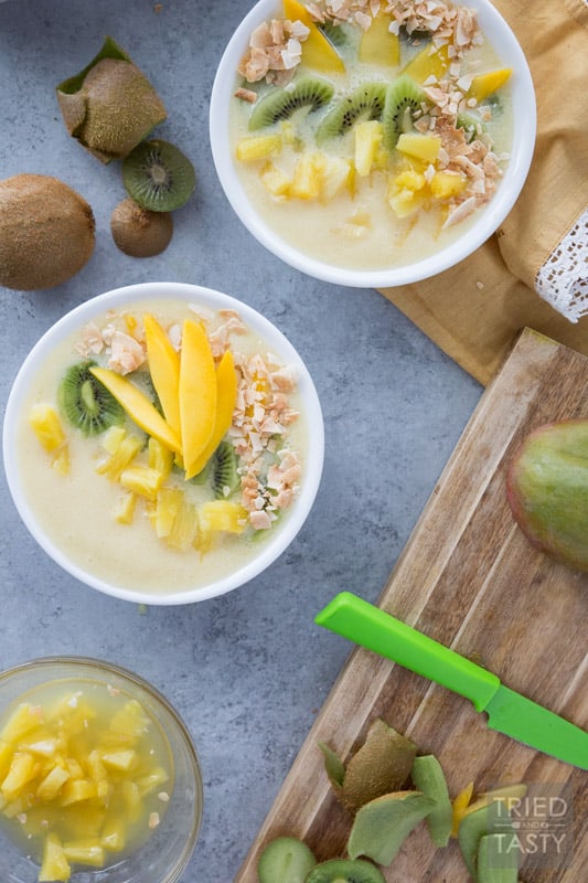 Tropical Dream Smoothie Bowl // The flavors of the tropics blended together into this delicious dairy-free smoothie bowl. If you're wanting to be transported to a warm and sunny vacation spot, this bowl makes you feel like those dreams are a reality! | Tried and Tasty