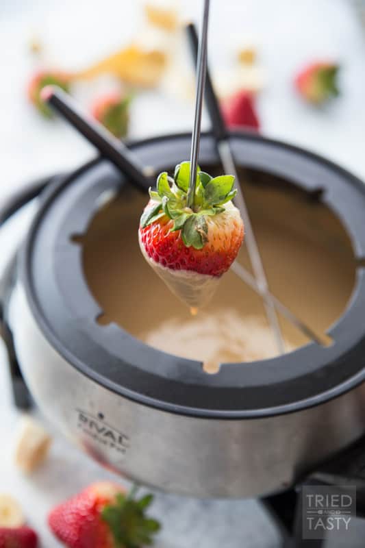 3-Ingredient White Chocolate Peanut Butter Fondue // Calling all fondue lovers! Tried of the traditional milk chocolate? Switch things up a bit with this fun new recipe that will surely tickle your tastebuds in the best way! Serve with your favorite fruit or dippers for a delicious sweet treat. | Tried and Tasty