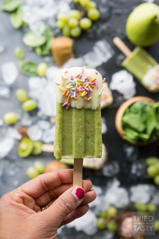 White Chocolate Dipped Kiwi Popsicles // Want a treat and want it to be healthy? These popsicles are exactly what you are looking for. Just blend, freeze, dip & enjoy! Made with the most delicious fruits and no added sugar! | Tried and Tasty