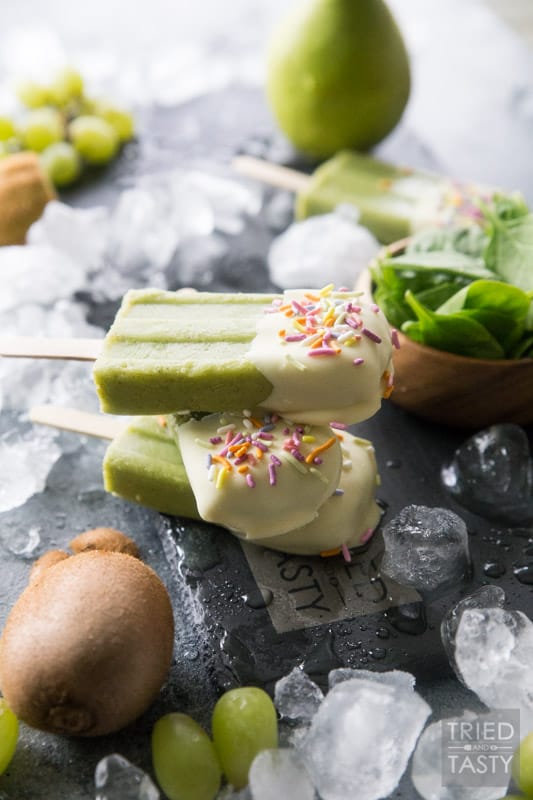 White Chocolate Dipped Kiwi Popsicles // Want a treat and want it to be healthy? These popsicles are exactly what you are looking for. Just blend, freeze, dip & enjoy! Made with the most delicious fruits and no added sugar! | Tried and Tasty
