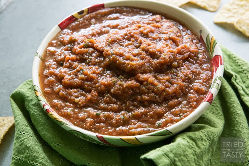 Six-Ingredient Fire Roasted Blender Salsa // Do you love a good salsa? If you've got a blender, then you can have this in less than five minutes! Next time you're at the store pick up everything you need (you probably have most everything on hand already!) and serve this salsa next time you're looking for a great snack! | Tried and Tasty