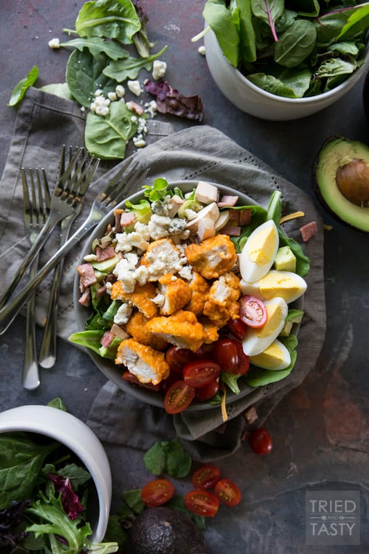 Buffalo Chicken Cobb Salad // Eating 'lighter fare' doesn't have to be tasteless and boring - I'm proving that to you with this delicious flavor packed salad! Comes together super easily and will keep you full through lunchtime and beyond. Take your Cobb salad to the next level, I promise you won't be sorry! | Tried and Tasty
