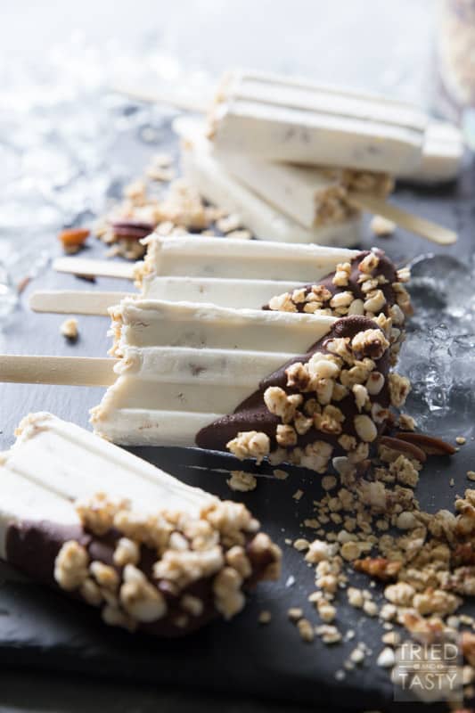 Maple Pecan Greek Yogurt Pops // Stay cool this summer with these creamy and dreamy greek yogurt pops, which are dipped in chocolate and topped with maple pecan granola. | Tried and Tasty.