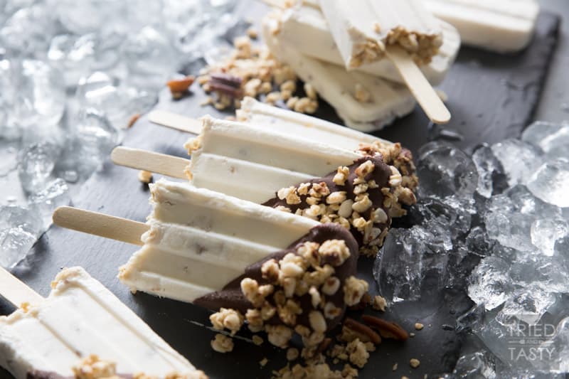 Maple Pecan Greek Yogurt Pops // Stay cool this summer with these creamy and dreamy greek yogurt pops, which are dipped in chocolate and topped with maple pecan granola. | Tried and Tasty.