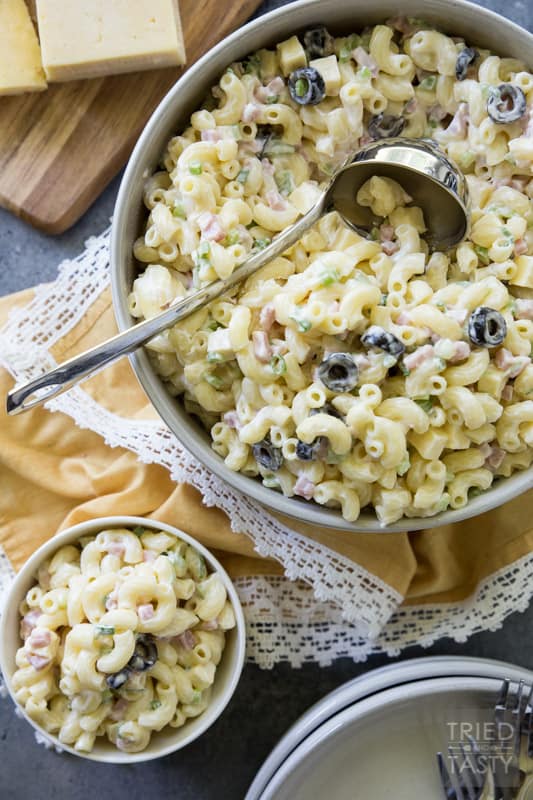 Sharp Cheddar Macaroni Salad // Make this at your next BBQ gathering as the perfect side dish. This macaroni salad recipe packs a delicious punch thanks to sharp cheddar. Your guests will be begging for the recipe! | Tried and Tasty