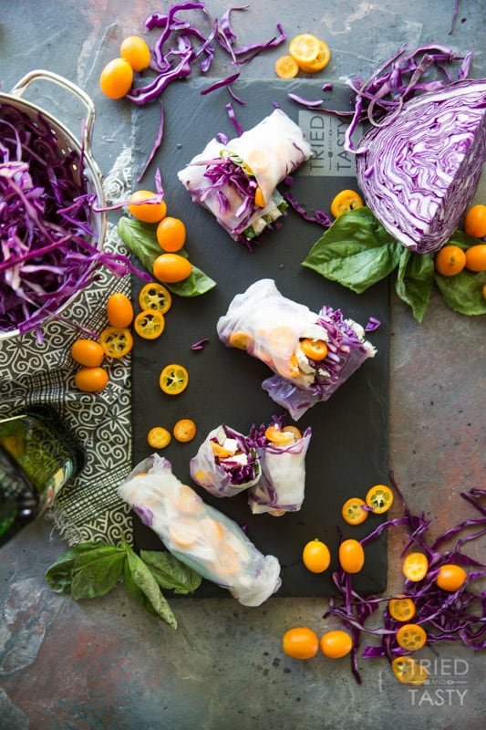 Summer Cabbage Spring Rolls // If you're looking for a refreshing, five ingredient, quick & easy appetizer (that could even double as a light lunch) - these spring rolls are exactly what you need! With flavors as vibrant as the colors, you can snack easy knowing you've got a tasty AND healthy option for any day of the week! | Tried and Tasty