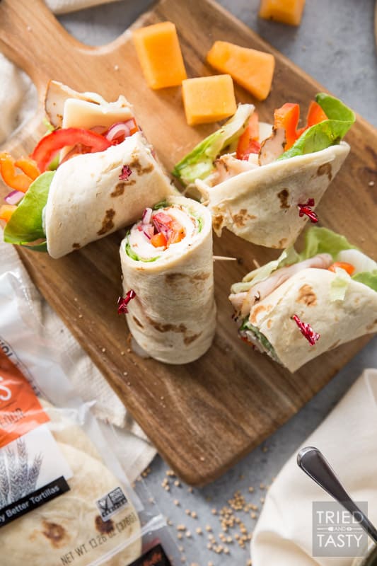 Turkey and Swiss Wrap // Lunch doesn't get easier (or tastier) than this! Start with a high quality tortilla, top with a few of your favorite things, slice and voila! Lunch is served! | Tried and Tasty