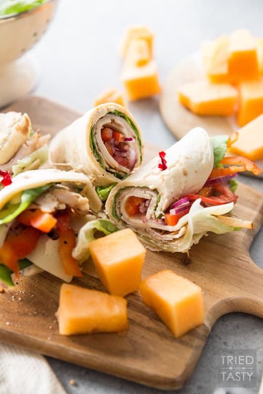 Turkey and Swiss Wrap // Lunch doesn't get easier (or tastier) than this! Start with a high quality tortilla, top with a few of your favorite things, slice and voila! Lunch is served! | Tried and Tasty