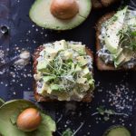 Savory Avocado Toast // This quick and easy snack that could double as breakfast or triple as lunch is simple to make & packed with nutrients! The twist? A smattering of spinach & artichoke dip underneath! | Tried and Tasty